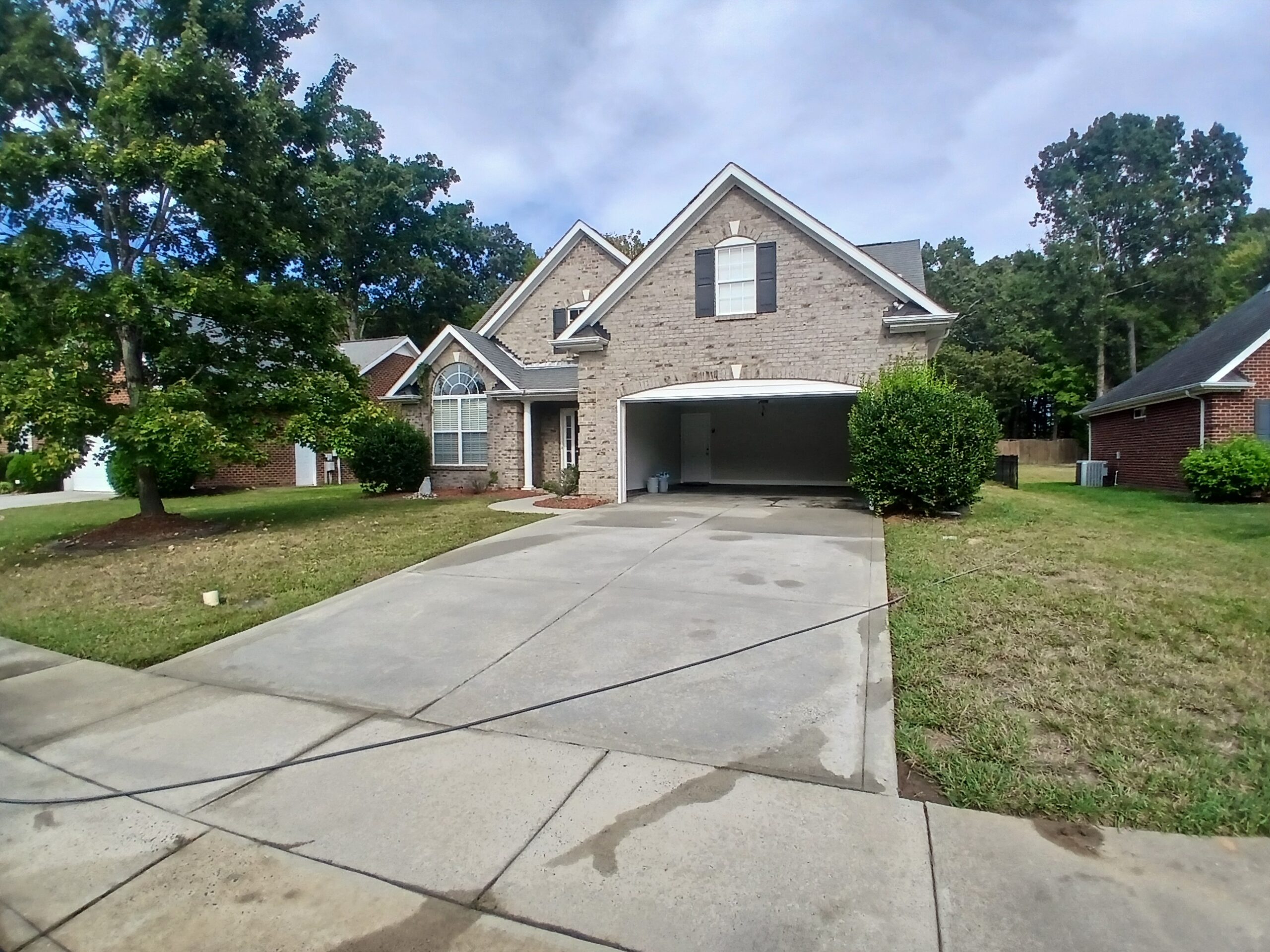 House washing, driveway, patio, and pool deck cleaning project in Crooked Creek Estates, Monroe, NC.